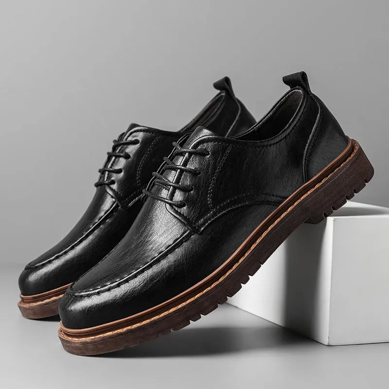 Men's black and brown British-style casual leather shoes with round toe and flat rubber sole.