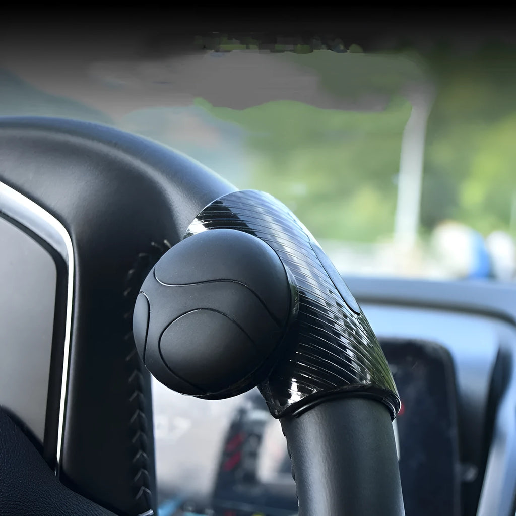 Steering wheel assist ball with silicone grip and metal bearing for single-hand steering control