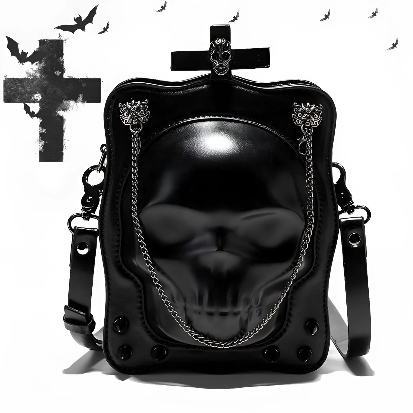 Black mini square crossbody bag with embossed skull design, metal chain strap, and zip opening.