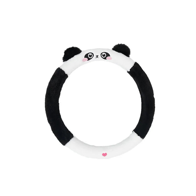 Plush steering wheel cover with embroidered bear design, shown fitted on a car steering wheel.