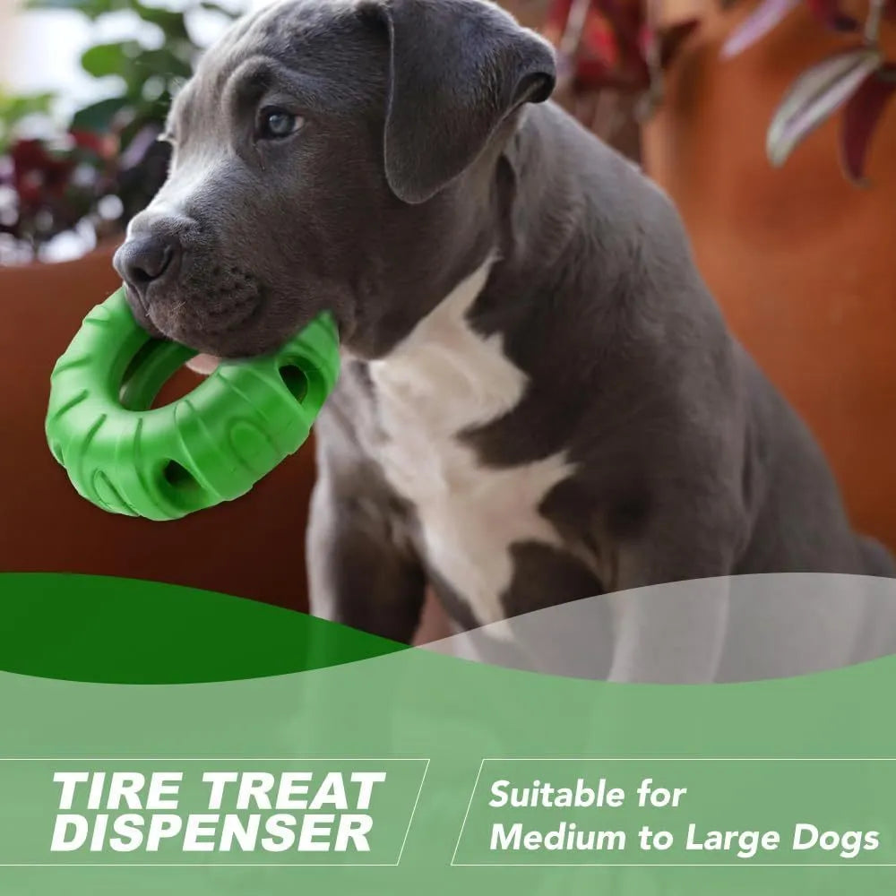 Blue natural rubber tyre-shaped dog chew toy with oval openings, for slow feeding and interactive play.