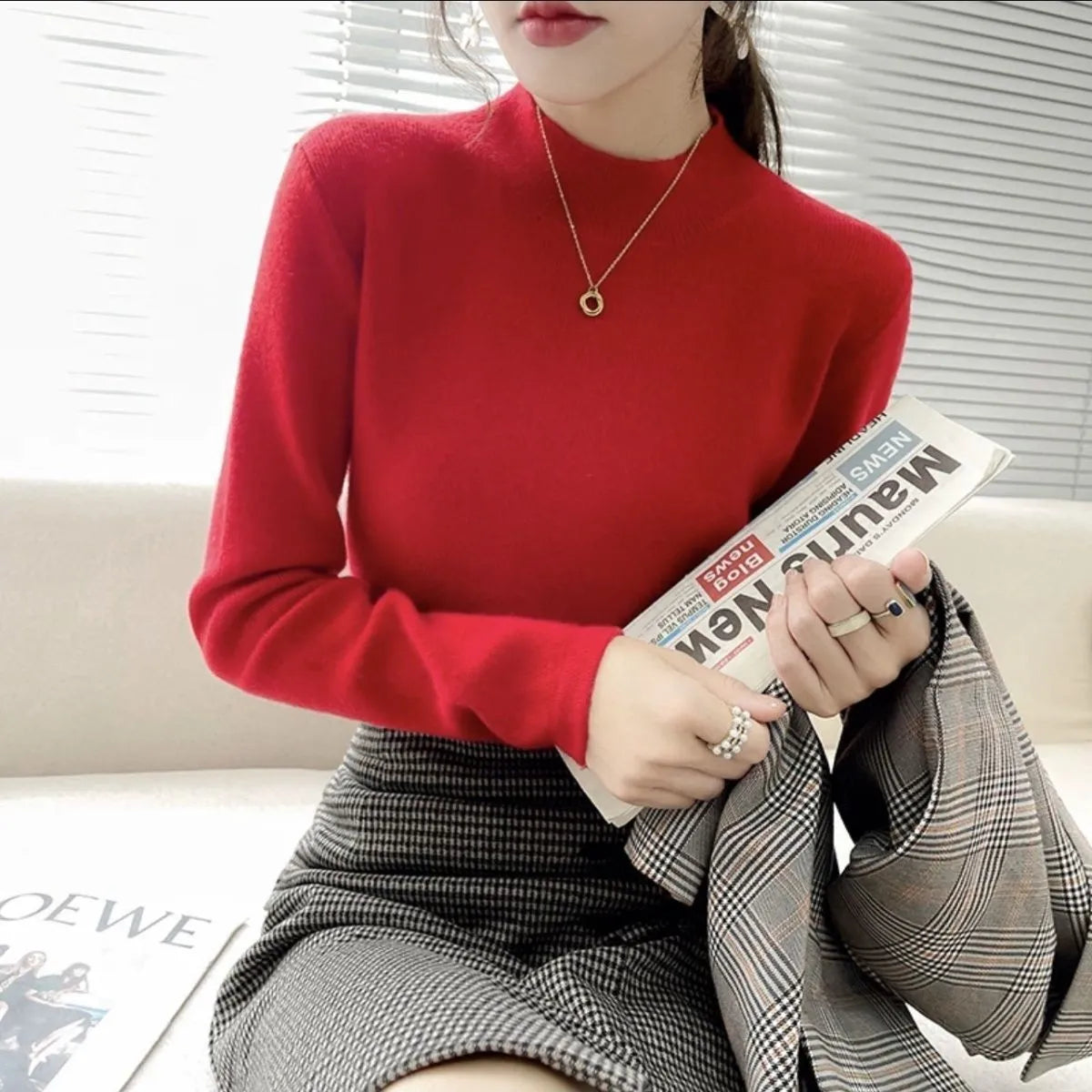 Slim fit apricot coloured viscose fibre knitted inner shirt with long sleeves laid flat.