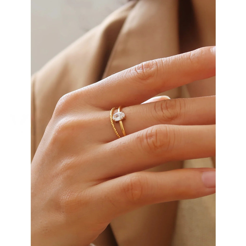 Golden love heart stainless steel ring showing heart shape design on female hand
