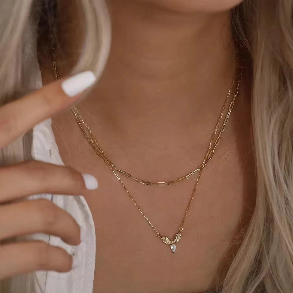 Silver necklace with eagle pendant on an adjustable O-ring chain, shown in white gold colour finish.
