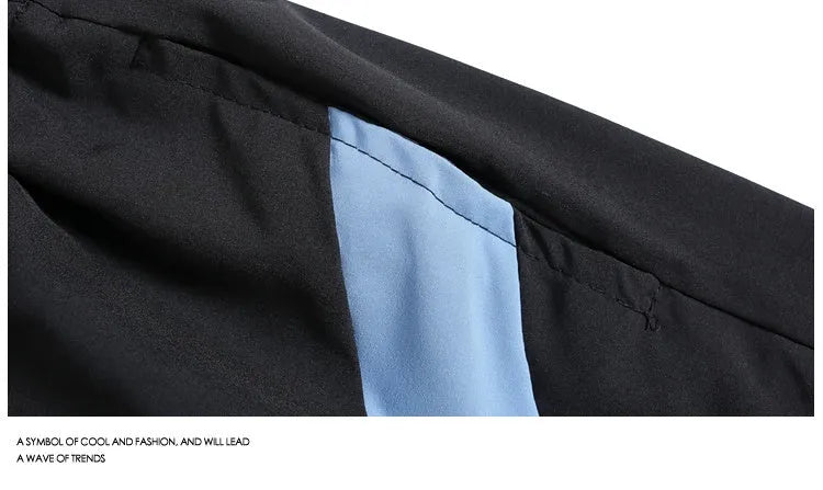 Quick-drying black and grey sports shorts with elastic waist and loose fit design