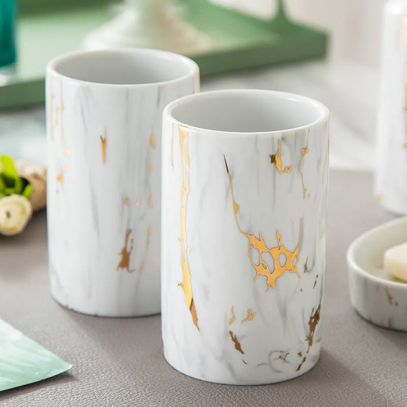 White ceramic bathroom wash kit with marble design showing two cups, latex bottle, and soap box