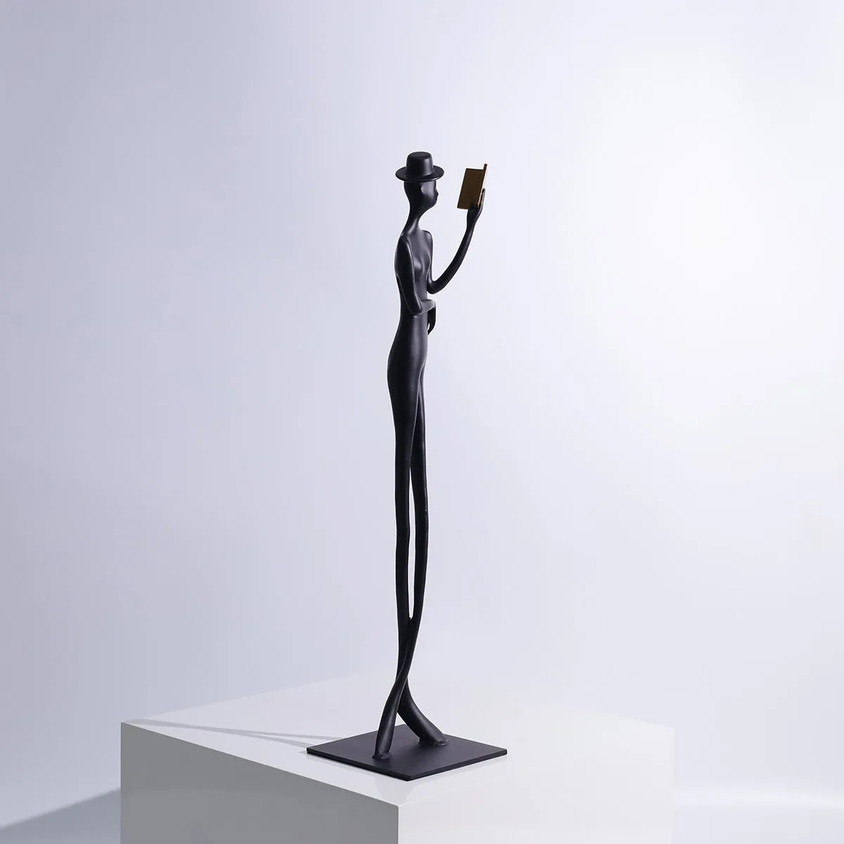 Black cast aluminium reading woman desktop sculpture modern minimalist design 51cm tall