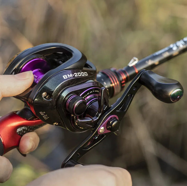 BM2000 fishing reel with colourful finish and magnetic brake system, shown in left-hand and right-hand model options.