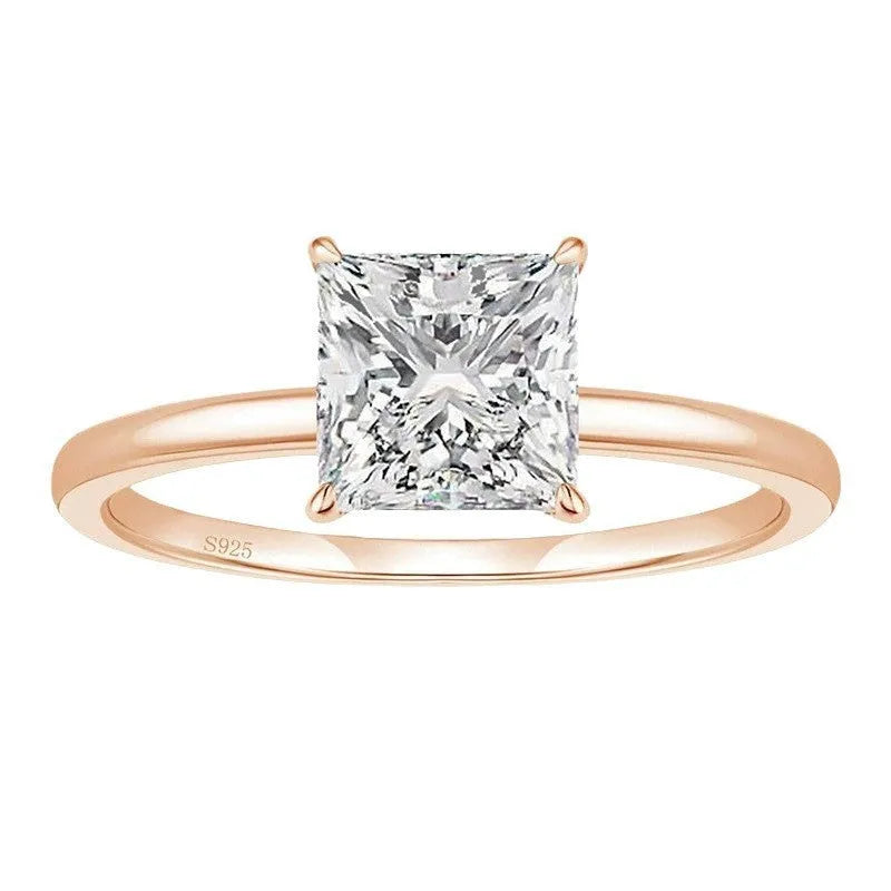 A simple geometric women's ring made of 925 silver with a round zirconium stone, shown in silver, gold, and rose gold colour options.