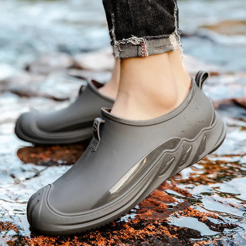 Men's short solid colour rain boots in plastic construction available in multiple colours