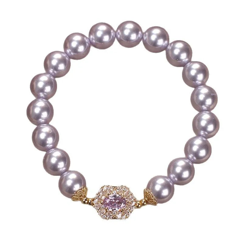 Dreamy purple zircon pearl bracelet with diamond flower charm on wrist
