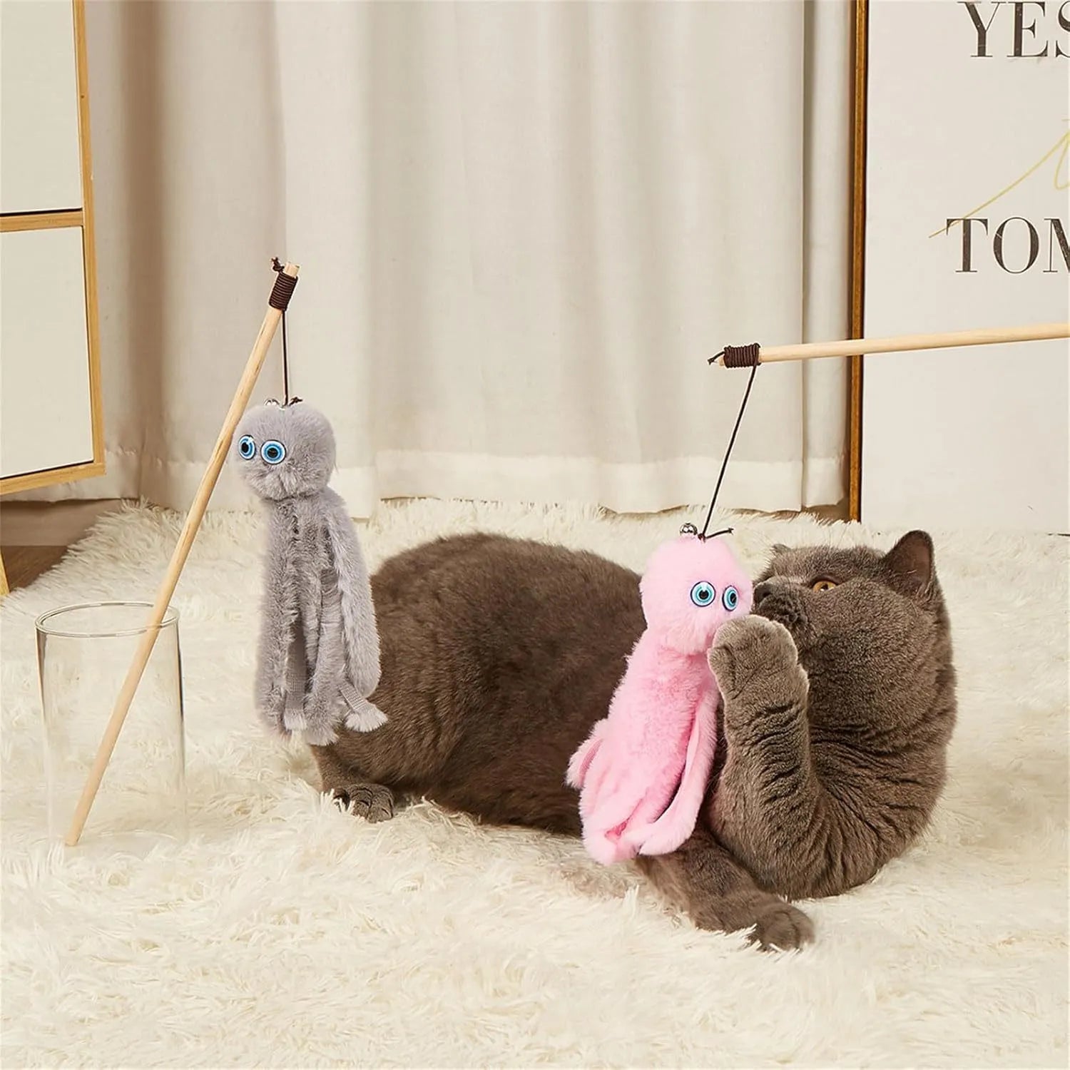 Octopus-themed cat toy with long stick handle in grey, pink, purple, or red colour options