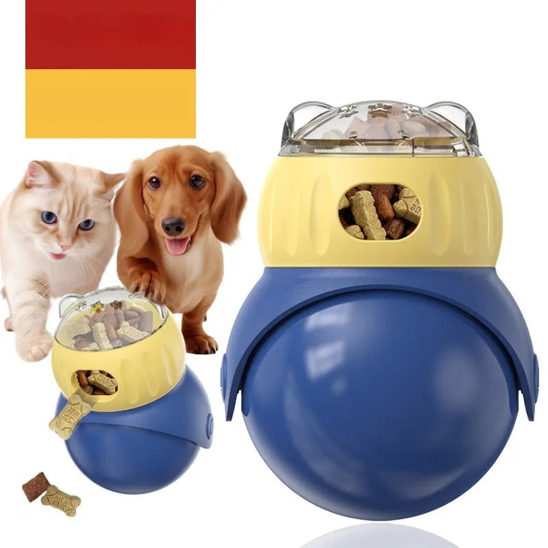 Owl-shaped yellow and blue plastic puzzle feeder for cats on a wooden floor.