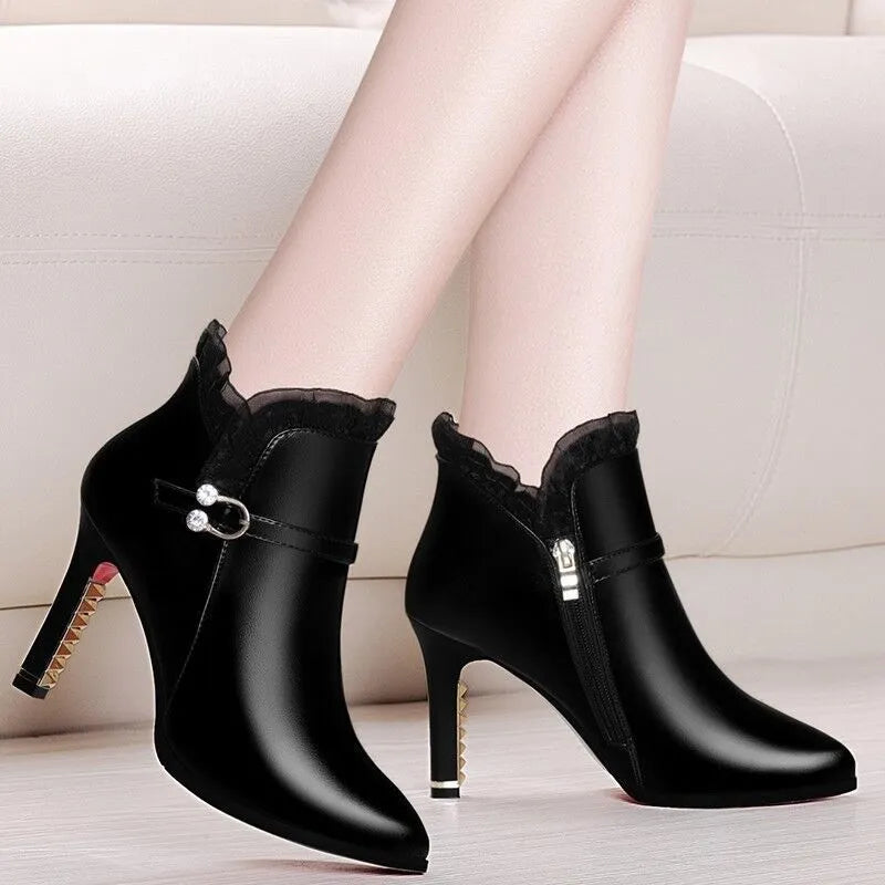 Women's over-the-knee black stiletto heel boots with side zipper and pointed toe