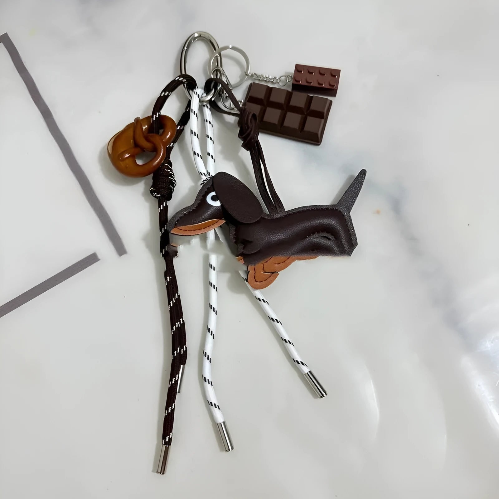 Alkaline bread braided rope keychain pendant in baseball style with bends and hitches