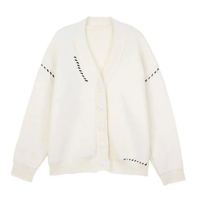 Women's loose-fit knitted cardigan coat in black or white.