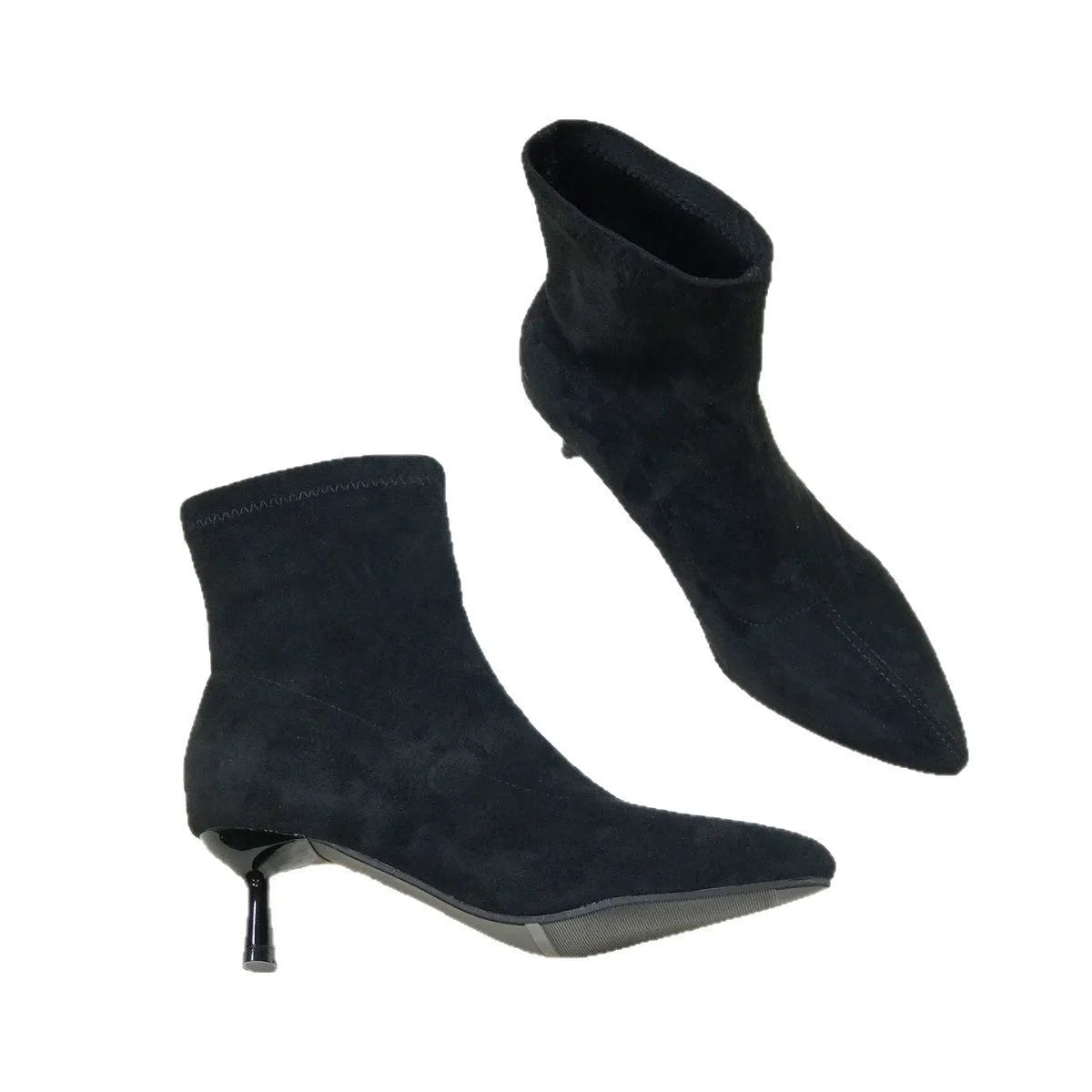 Black women's pointed toe ankle boots with a stiletto heel, shown on a foot.