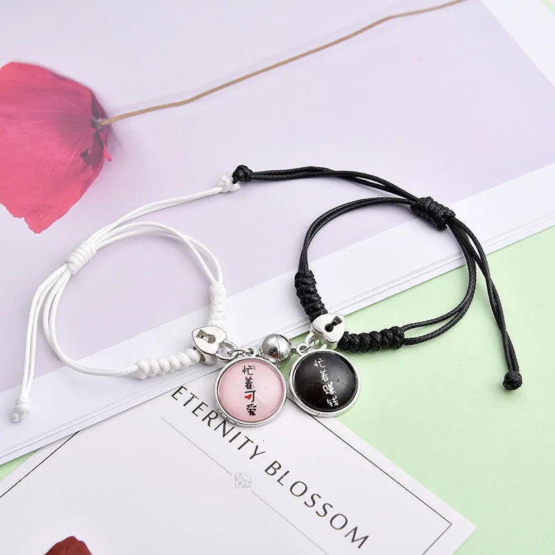 Magnet suction couple bracelets with alloy construction and various pendant designs including crowns and hearts