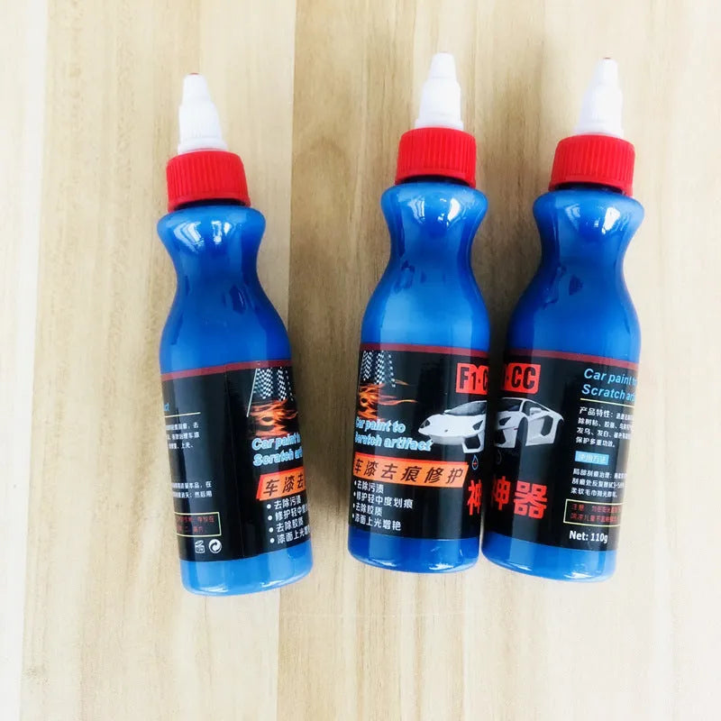 Small blue bottle of car scratch repair agent for wipe-on application to vehicle paint surfaces