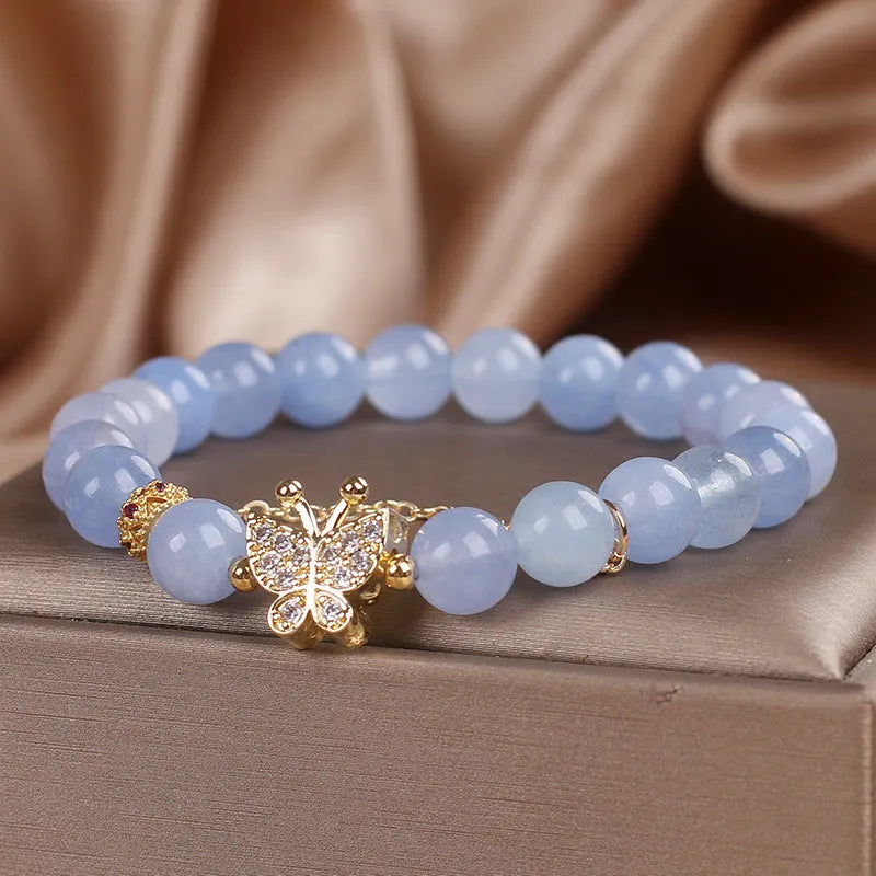Sky blue butterfly crystal bracelet for women with pearls, rhinestones, and sequins on a 17cm chain.