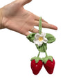 Handmade strawberry-shaped weaving pendant made of cotton and hemp wool for car decoration.
