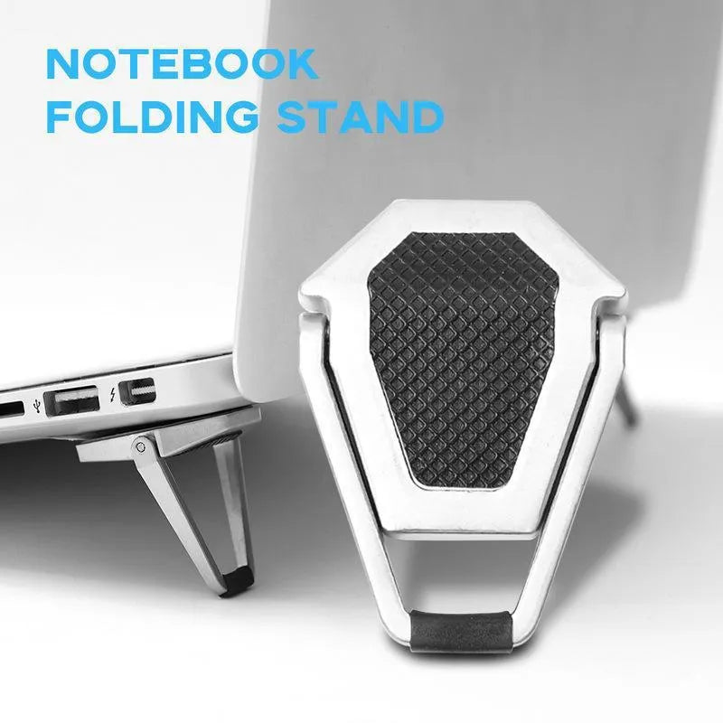 Silver foldable aluminium laptop bracket shown next to 3M adhesive glue on desktop