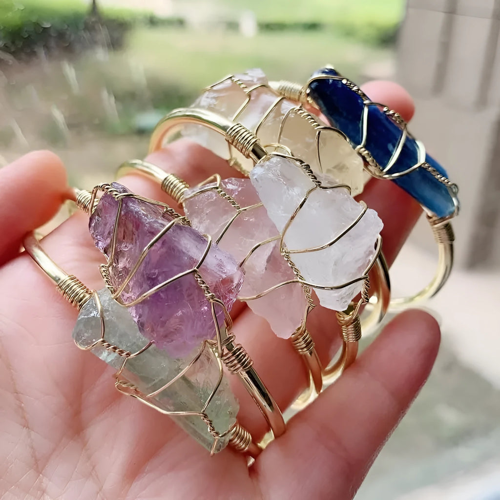 Unisex geometric bracelet made from rough natural crystals with gold metal winding.