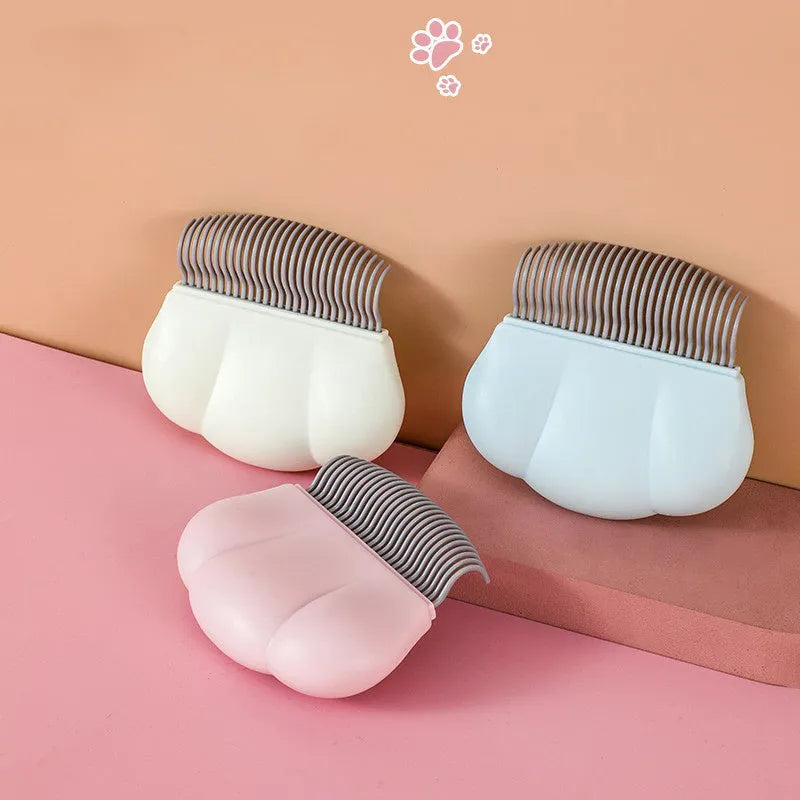 Paw Soft pet deshedding brush in blue, pink, or white with 4-row silicone bristles