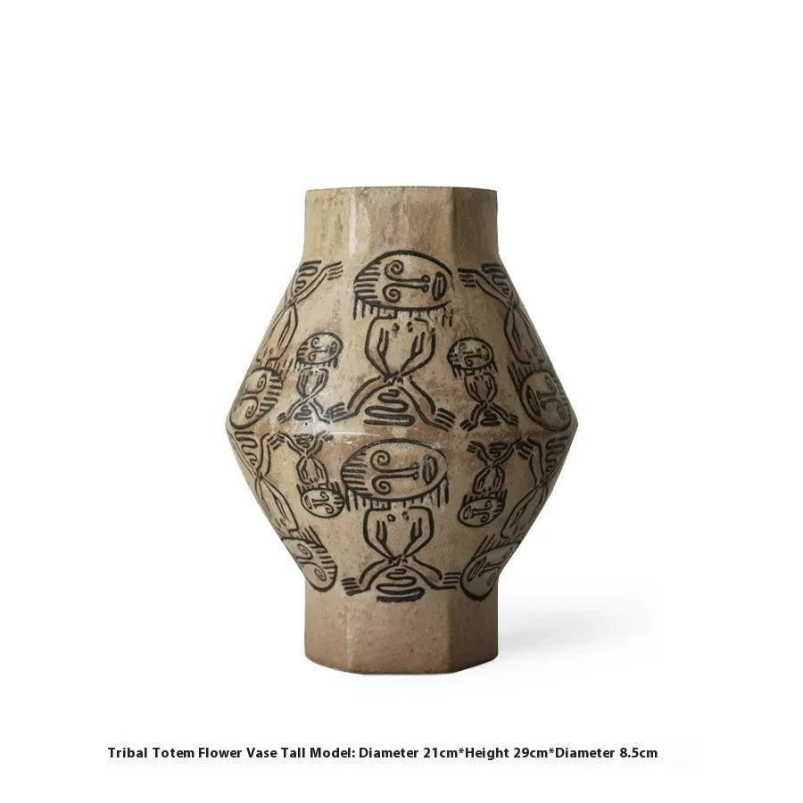 Hand-painted cylindrical ceramic vase with vintage carved tribal totem patterns in high or low style.