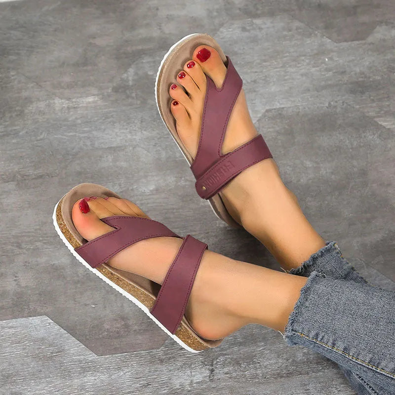 Blue thick-soled flat toe ring flip-flops on a white background.