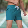 Men's black fitness training shorts with high waist design and drawstring closure