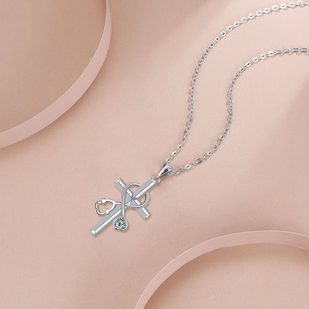 Women's copper electroplated necklace with stethoscope pendant on cross chain