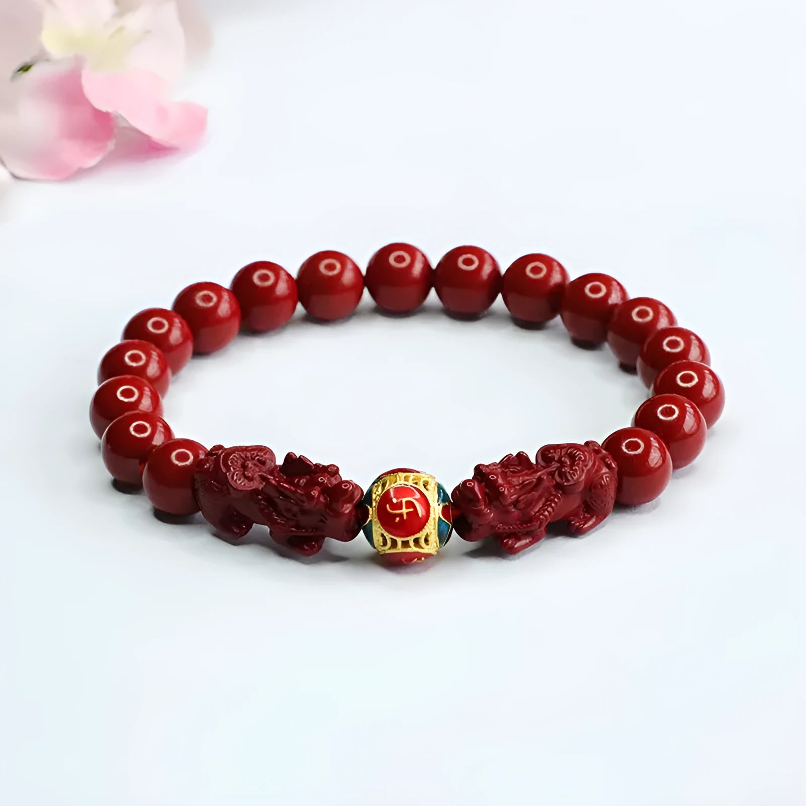 Close-up of a purple gold sand carved cinnabar women's bracelet with a double Pixiu design.