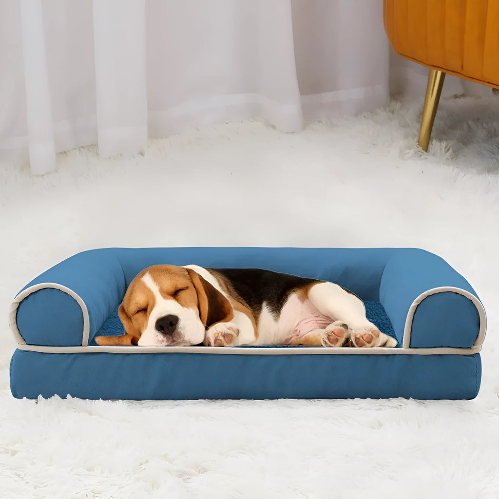 Square cloth dog bed with sponge filling, shown in blue, dimensions example 75cm long by 50cm wide.