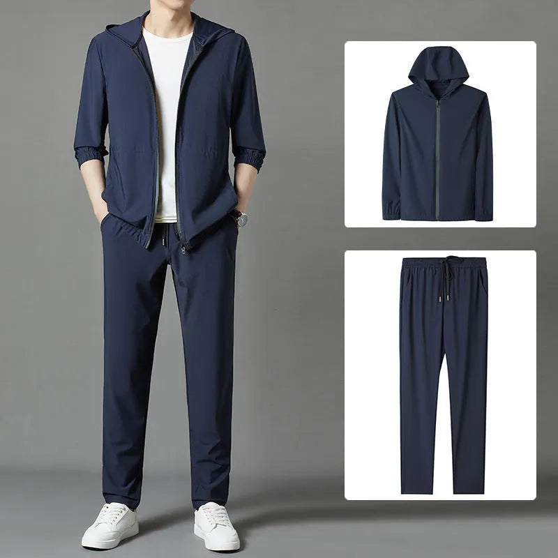 Grey loose-fit hooded sun-protective jacket and trousers set on a hanger