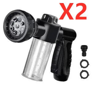 Green high-pressure foam spray gun for car washing with adjustable nozzle and attached water pipe.