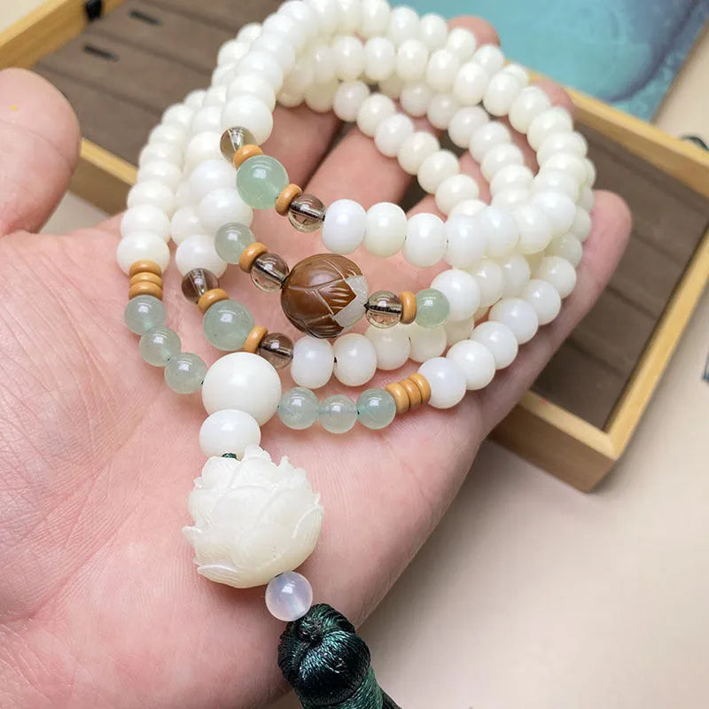 White Jade Bodhi bead bracelet with 108 beads, showing three different carved pattern styles.