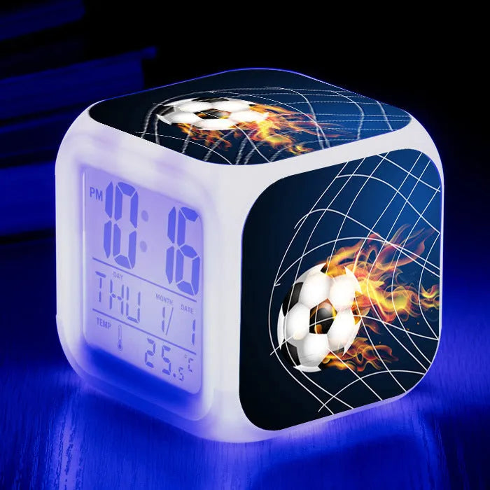 Square cartoon football pattern mute alarm clock for students and children on a desk.