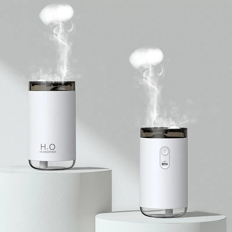 White jellyfish-shaped USB humidifier with warm night light on wooden surface