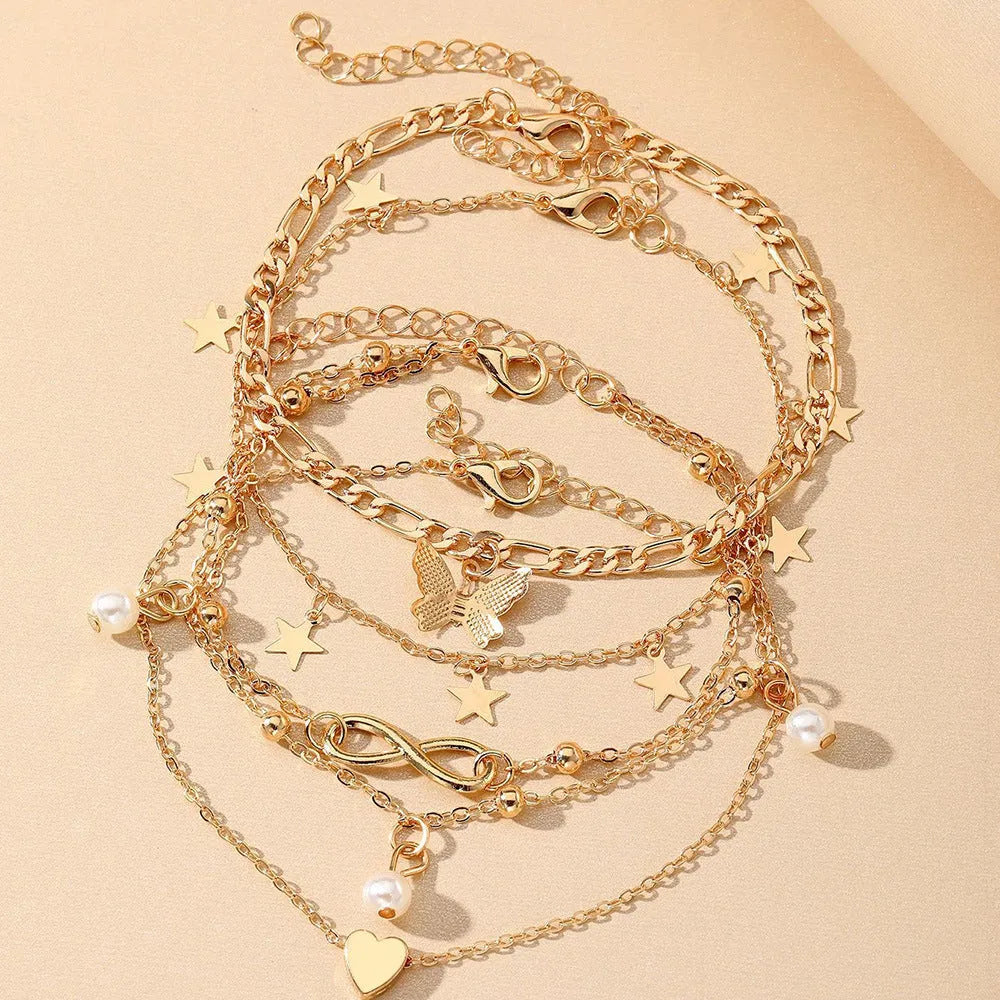 Butterfly pearl heart women's anklet set showing four layered alloy foot chains with butterfly and heart charms