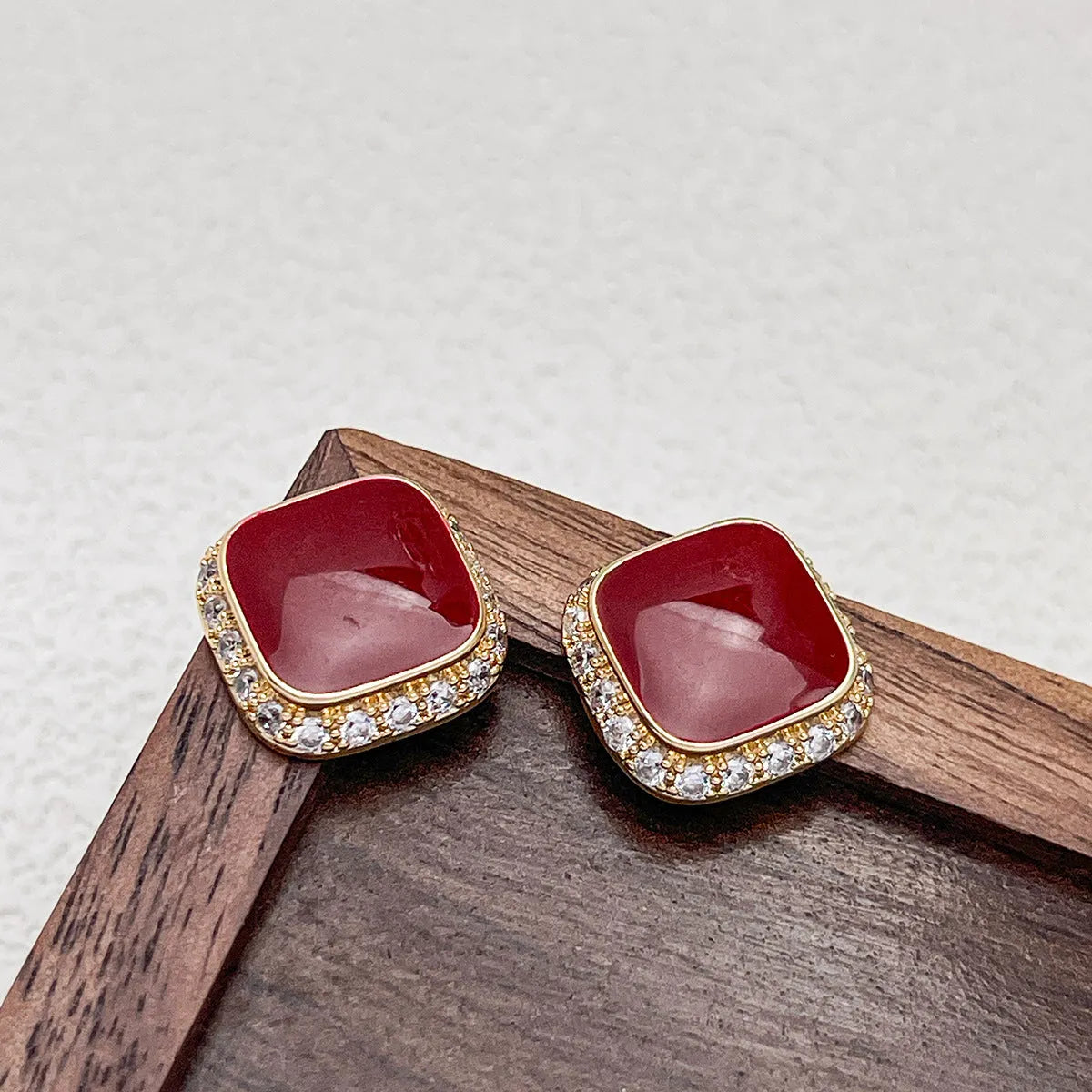 Red geometric square alloy earrings with clip-on fastening and embedded square design elements