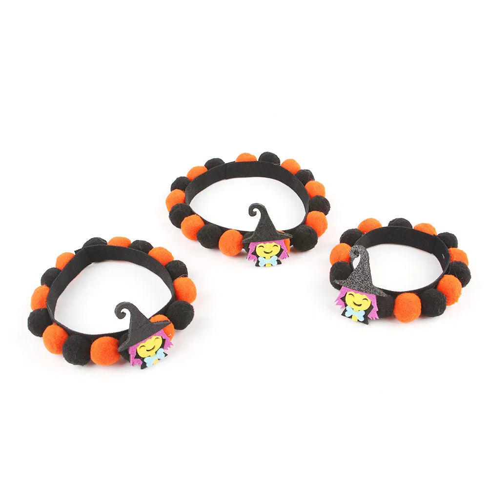 Halloween pet collar with fur ball decoration in pumpkin design on dog neck