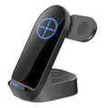 Black grey foldable wireless charging stand holding a mobile phone vertically, with slots for a smartwatch and earbuds case.