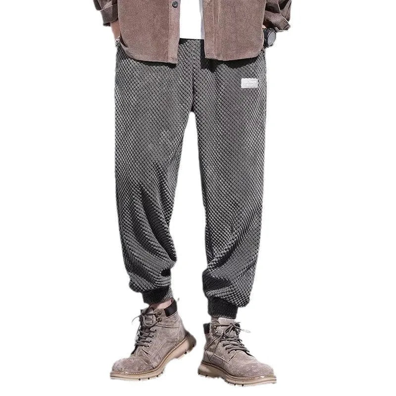 Men's grey ankle-tied casual sport sweatpants with straight leg design on hanger