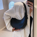 Women's retro brown dumpling-shaped PU leather shoulder bag showing front and internal zipper pocket.