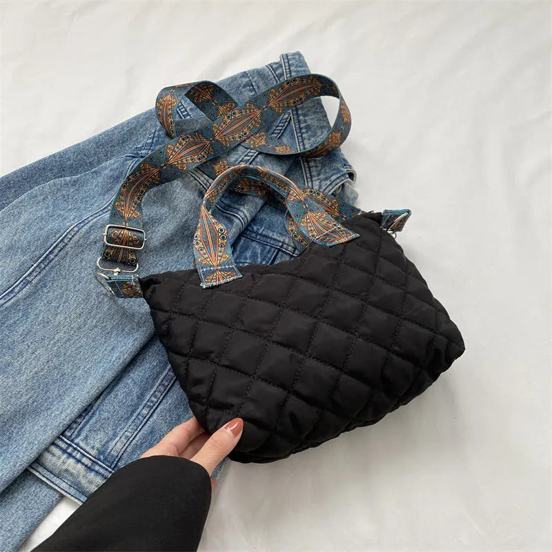 A soft Oxford cloth shoulder messenger bag in a horizontal square shape with embroidery detail.