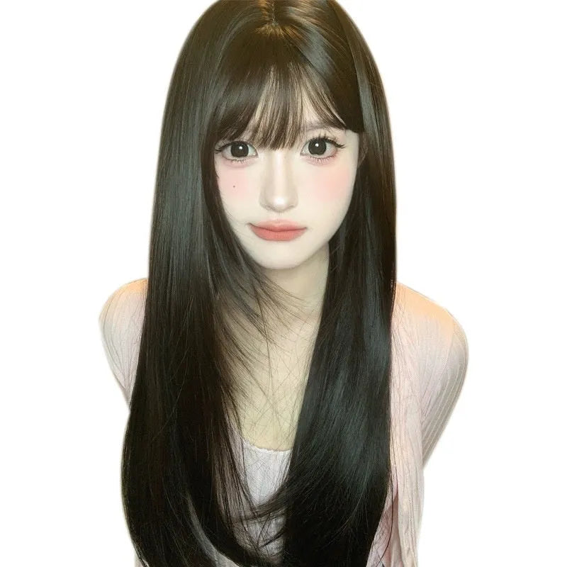 A dark brown long straight synthetic wig with a fringe on a wig stand.