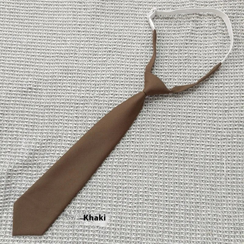 A navy blue cotton men's bow tie with an arrow style design on a white background.