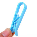PP plastic non-slip clip for securing a rubbish bag to the side of a bin.