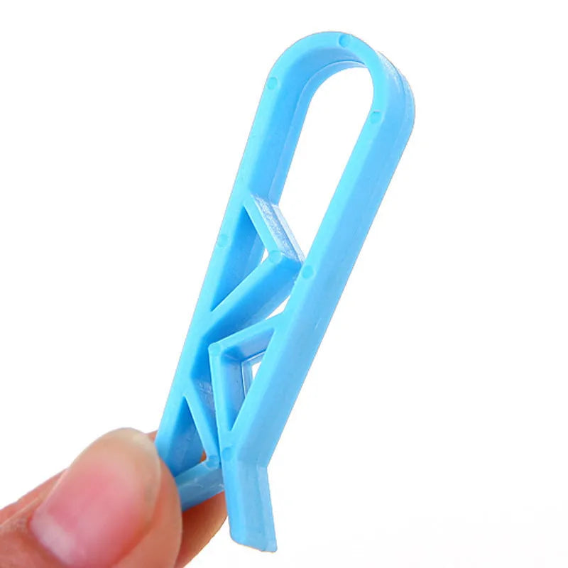 PP plastic non-slip clip for securing a rubbish bag to the side of a bin.